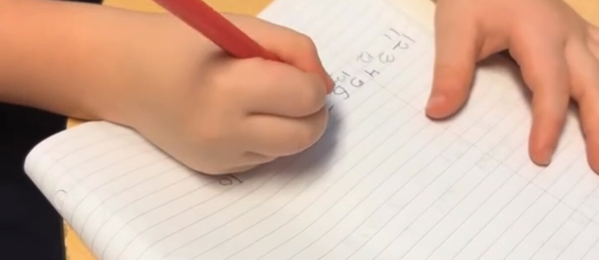 A child moving and playing during a classroom session